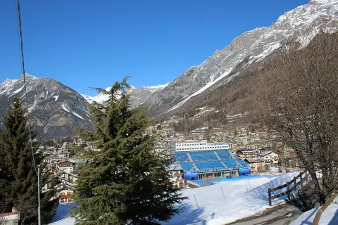 View of Bormio with the Stelvio ski run finish area and surrounding Alps.