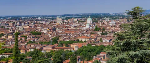 Panoramic skyline view of Brescia showing the distinctive dome of the Duomo Nuovo cathedral