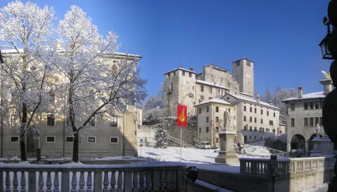 Historical engraving of the town of Feltre with the Vette Feltrine mountains in the background