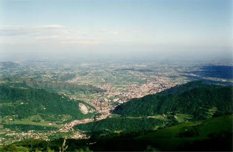Panoramic high-angle view of Vittorio Veneto and the surrounding hills.