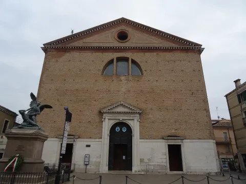 Facade of the Cathedral of Santa Maria Assunta in Chioggia with war memorial