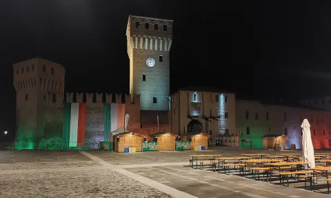The illuminated Formigine Castle at night in Modena, Italy.