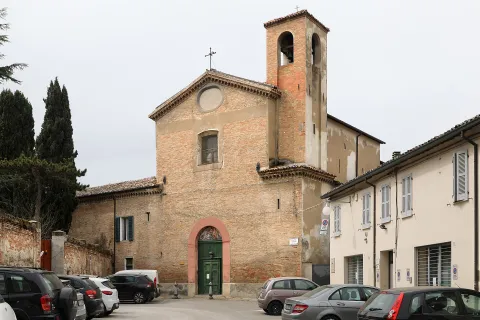 View of the facade of a historic church in Faenza