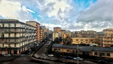 Urban view of Milazzo showing residential apartment buildings and street