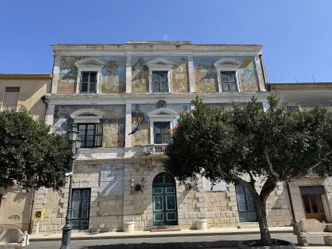 Frescoed facade of a historic building in Licata, Agrigento, Sicily.
