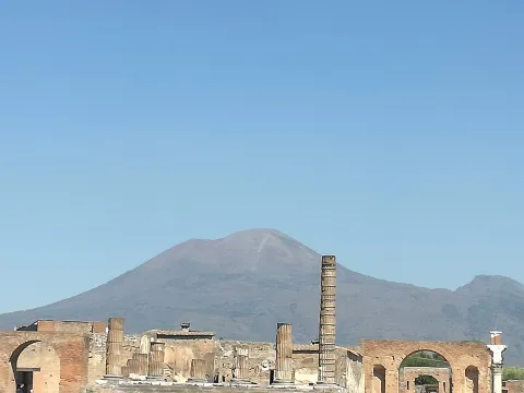Ancient ruins of the Archaeological Park of Pompeii with Mount Vesuvius in the background