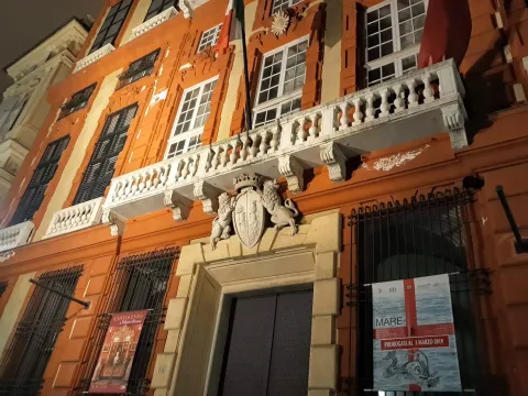Illuminated facade of Palazzo Nicolosio Lomellino in Via Garibaldi, Genoa