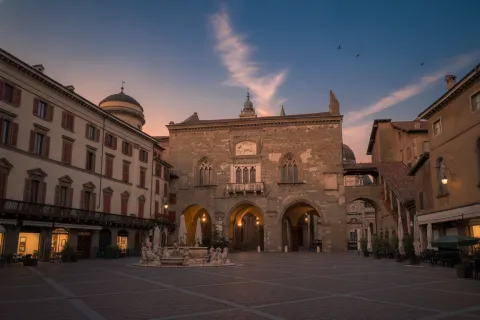Piazza Vecchia in Bergamo's Città Alta featuring the historic Palazzo della Ragione.