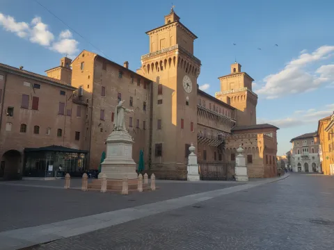 Castello Estense with the statue of Girolamo Savonarola in Ferrara, Italy.