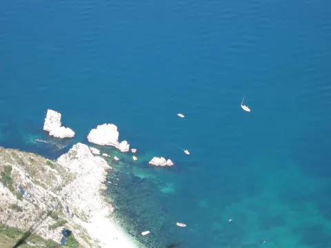 Aerial view of the Spiaggia delle Due Sorelle and turquoise sea in Sirolo.