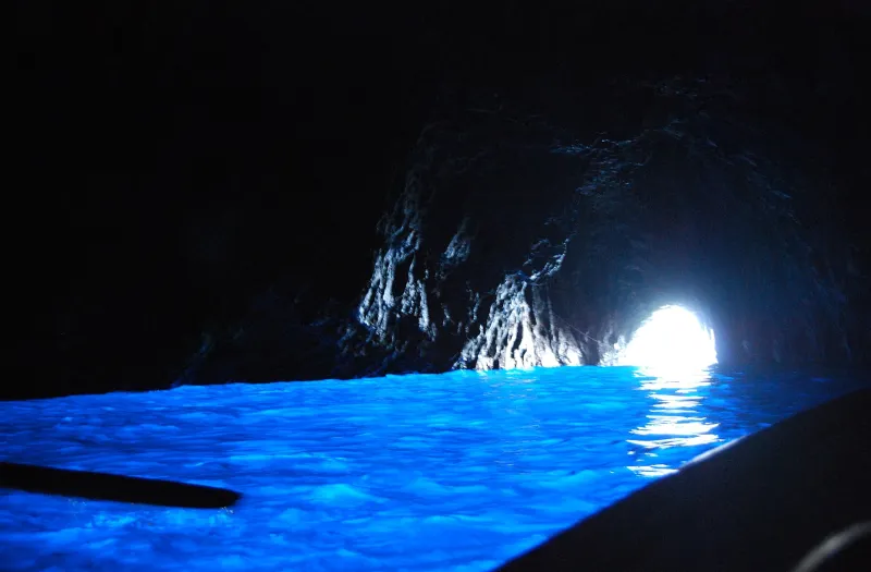 Glowing electric blue water inside the Grotta Azzurra sea cave in Anacapri